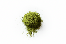 Green powder on a white background