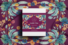 Care Tea package with floral design on a purple fabric background