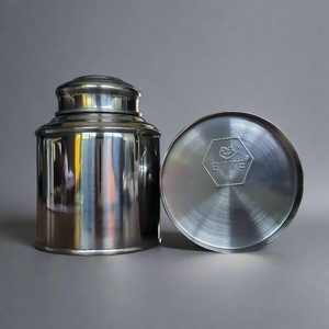 2 Customisable tea tins. With ETTE TEA logo showing at the bottom of one of the tin lying down.