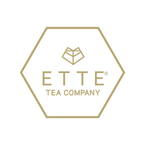 Logo of ETTE Tea Company with a gold hexagonal border on a white background
