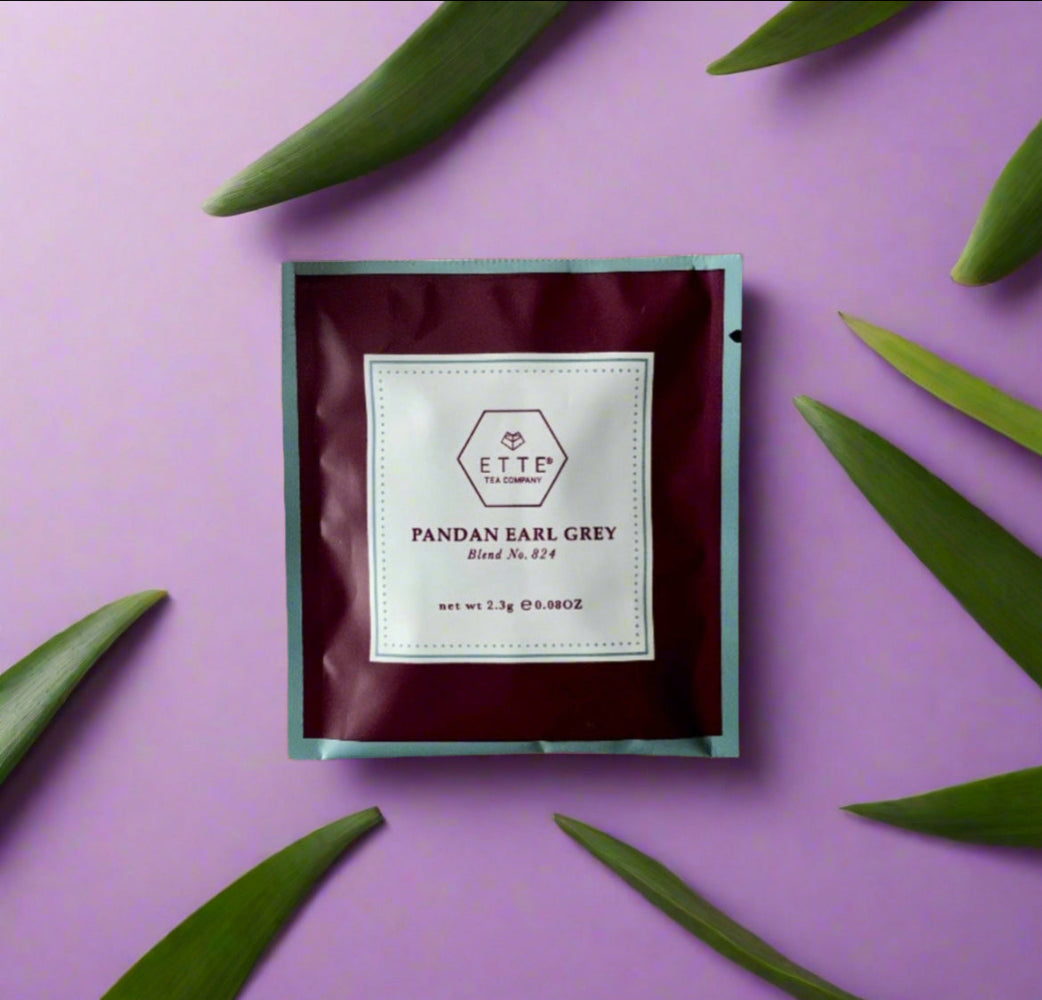 Tea bag packaging with 'ETTE TEA' branding on a purple background with green Pandan leaves.