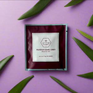 Tea bag packaging with 'ETTE TEA' branding on a purple background with green Pandan leaves.