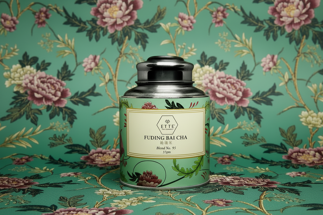 Tea canister labeled 'Fuding Bai Cha' on a floral patterned background