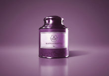 Purple candle with a label "MANSIONETTE" on a white background
