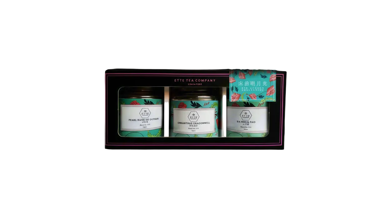 Three tea tins in a box with 'ETTE Tea Company' branding on a light gray background