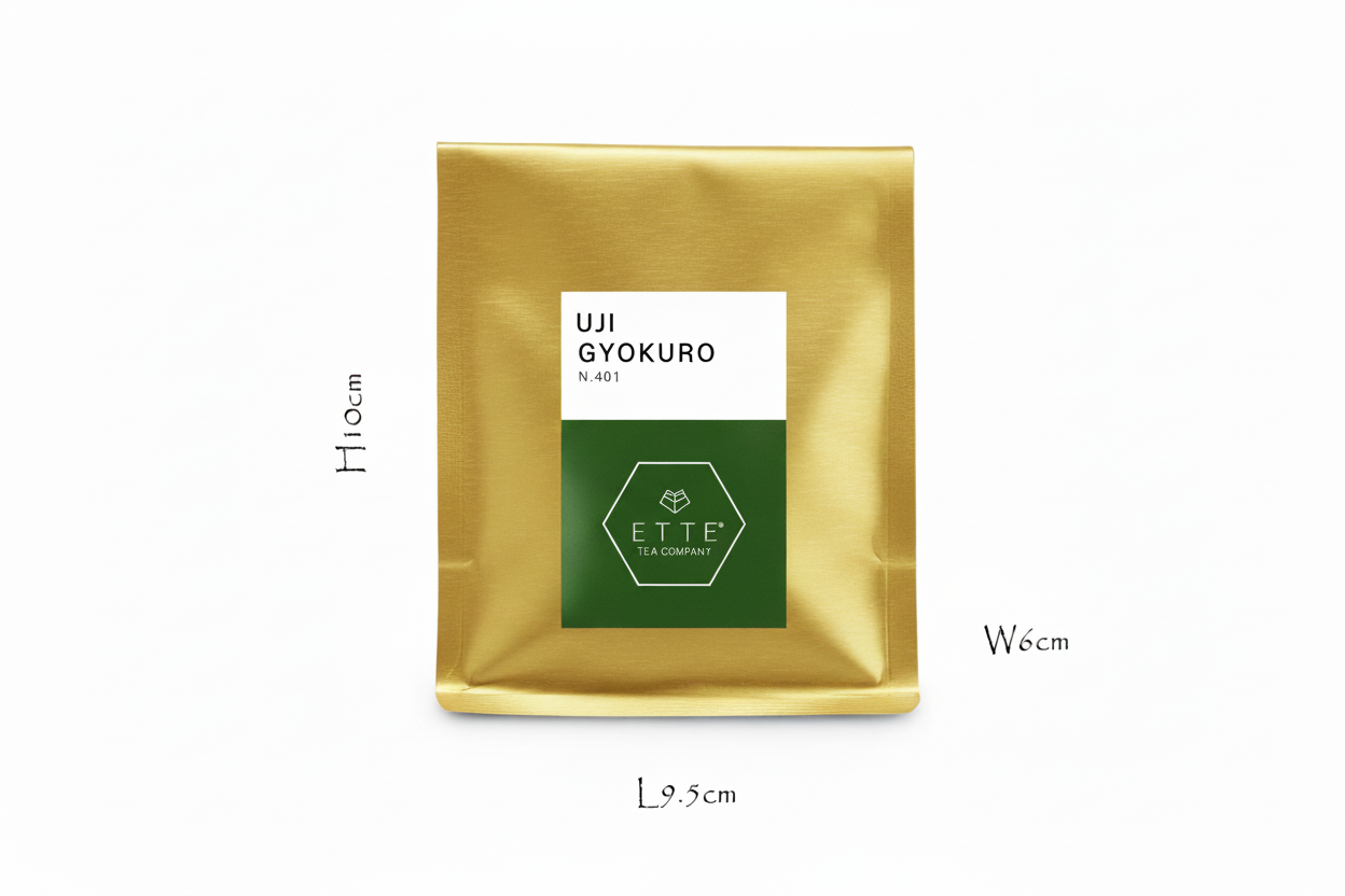 Gold tea bag with a label on a white background