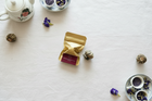 Tea packaging with dried flowers on a textured surface
