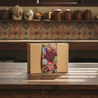 SEDAP box with a colorful floral KEBAYA PURPLE design on a white surface, with shelves in the background.