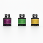 Three tea canisters with labels for Pandan Chiffon, Nasi Lemak, and Mango Sticky Rice.