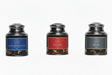 Three candle jars with labels on a white background