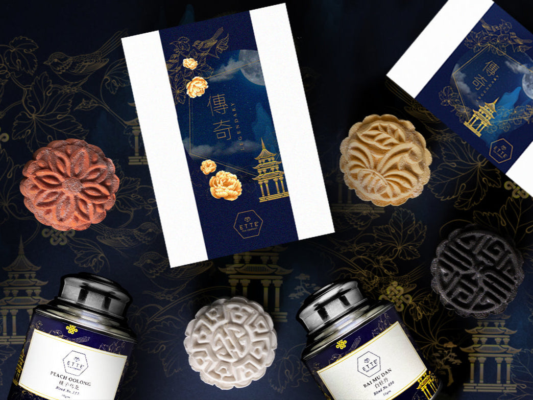 Traditional mooncakes with decorative packaging on a dark background