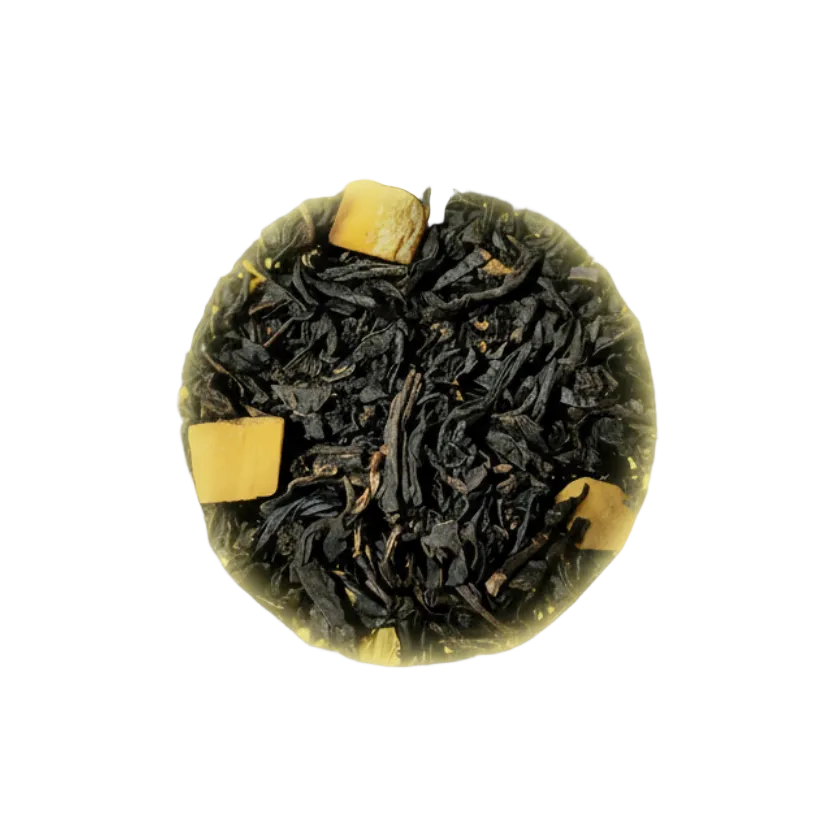 Close-up of black tea leaves with a yellowish background