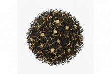 Black tea leaves with gold buds on a white background