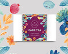 A box of CARE TEA assortment with 12 sachets, featuring a colorful design with floral and fruit illustrations. The box is labeled in such a way that it showcases different tea names, including IMMUNITEA, Halia Citron, Sang Ju Bai Cha, and Chai Hong.