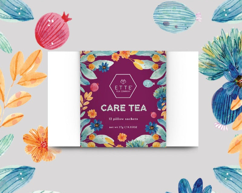 A box of CARE TEA assortment with 12 sachets, featuring a colorful design with floral and fruit illustrations. The box is labeled in such a way that it showcases different tea names, including IMMUNITEA, Halia Citron, Sang Ju Bai Cha, and Chai Hong.
