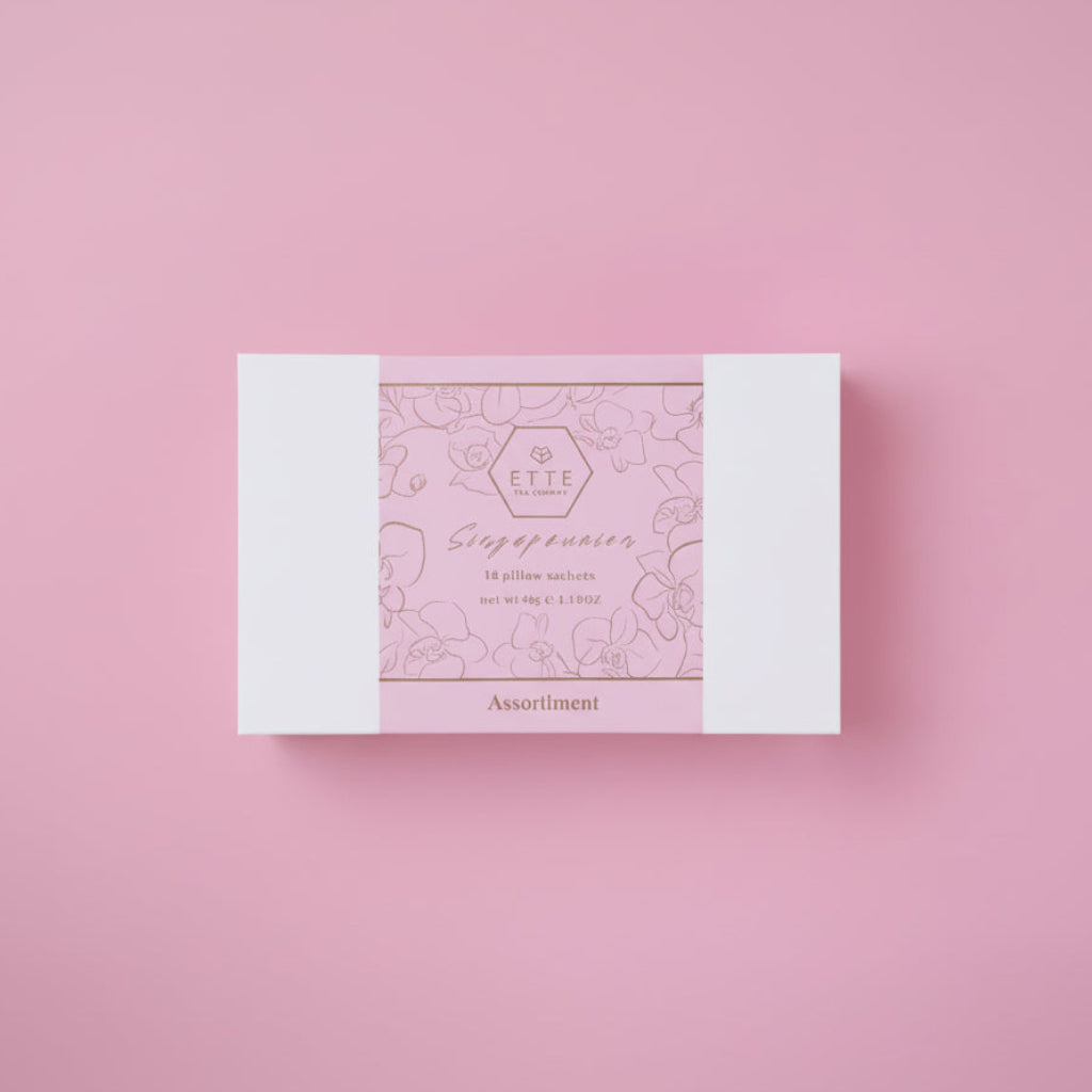Pink and white product packaging on a pink background